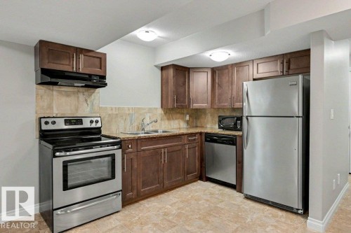 2 Simmonds Place, Leduc, AB - Indoor Photo Showing Kitchen With Double Sink