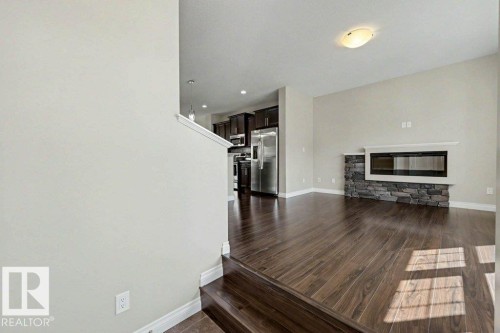 2 Simmonds Place, Leduc, AB - Indoor Photo Showing Living Room With Fireplace