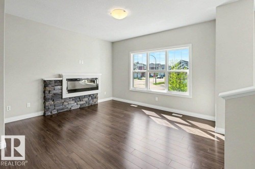 2 Simmonds Place, Leduc, AB - Indoor Photo Showing Living Room With Fireplace
