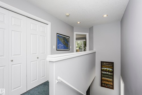 Hallway with recessed lighting and paneled closet doors - 11619 125 Street, Edmonton, AB 