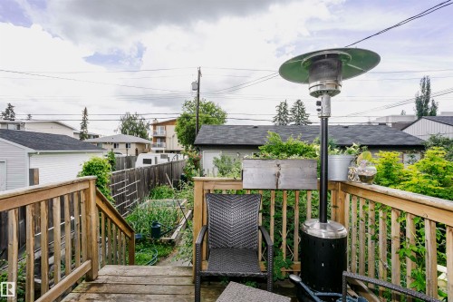 Wood-finish deck with wooden railings, providing an elevated outdoor area - 11619 125 Street, Edmonton, AB 