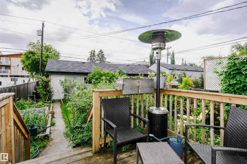 Expansive wood deck with a full railing system - 11619 125 Street, Edmonton, AB 
