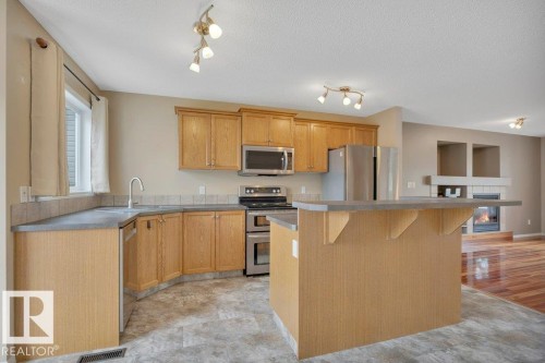 Loads of upgraded cabinets and Luxury Vineyl Plank Floor with cork backing - 7948 13 Avenue, Edmonton, AB 