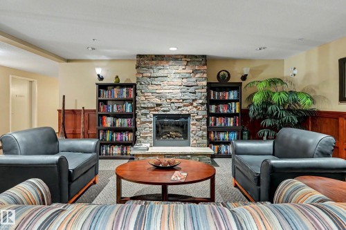 401 1589 Glastonbury Boulevard, Edmonton, AB - Indoor Photo Showing Living Room With Fireplace