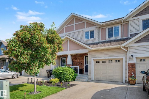 Two-story residence featuring light-colored siding and brick accents - 12119 167A Avenue, Edmonton, AB 