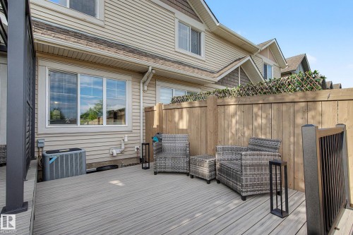 Spacious outdoor deck featuring composite decking and dark gray railing - 12119 167A Avenue, Edmonton, AB 
