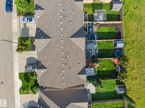 Aerial view highlighting multiple properties with pitched shingle roofs and fenced backyards - 12119 167A Avenue, Edmonton, AB 