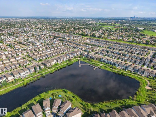 Aerial perspective showcasing a residential community centered around a prominent lake - 12119 167A Avenue, Edmonton, AB 