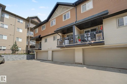 Multi-level building exterior featuring a mix of horizontal siding and textured panels - 25 12004 22 Avenue, Edmonton, AB - Outdoor With Balcony With Exterior