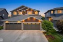 Crafted exterior featuring horizontal siding and wood-finish accents - 5129 Lark Crescent, Edmonton, AB 