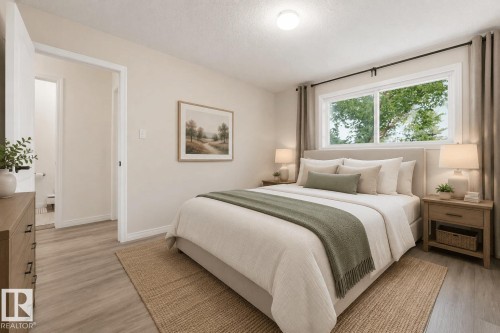 Bedroom featuring wood-finish flooring, a contemporary window, recessed lighting, and a neutral color palette - 105 16428 109 Street, Edmonton, AB 