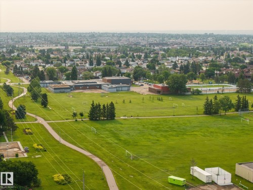Expansive green spaces featuring walking paths, mature trees, and sports fields - 105 16428 109 Street, Edmonton, AB 