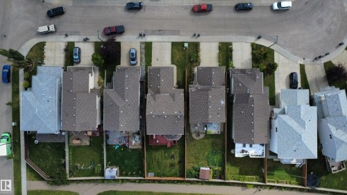 Aerial perspective showcasing multiple residential properties - 1216 37C Avenue Nw, Edmonton, AB - 