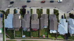 Aerial perspective showcasing multiple residential properties - 