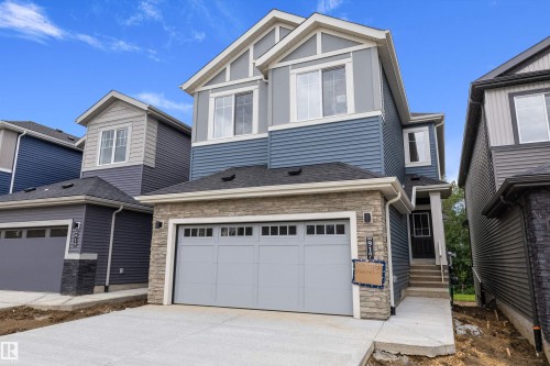 Modern two-story residence featuring a stone and siding facade - 917 Elderberry Landing, Edmonton, AB 