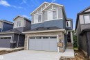 Modern two-story residence featuring a stone and siding facade - 917 Elderberry Landing, Edmonton, AB 