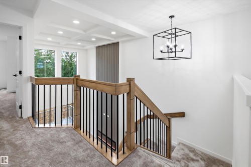 Upper-level landing featuring a coffered ceiling with recessed lighting - 917 Elderberry Landing, Edmonton, AB 