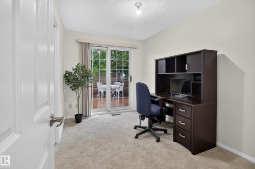 Sliding glass door opening to an outdoor deck - 17603 85 Avenue Nw, Edmonton, AB 