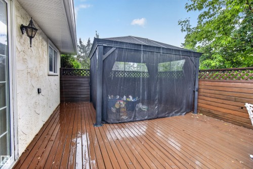 Spacious outdoor decking featuring a dark-toned privacy gazebo - 17603 85 Avenue Nw, Edmonton, AB 