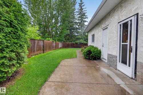 Spacious concrete patio with access to the building's exterior - 17603 85 Avenue Nw, Edmonton, AB 