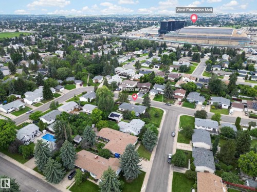Aerial perspective showcasing a residential neighborhood with a dense tree canopy - 17603 85 Avenue Nw, Edmonton, AB 