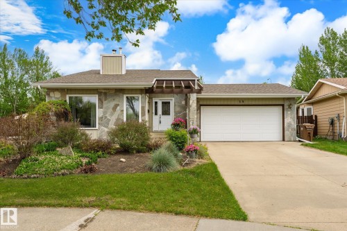 Stone veneer exterior featuring a prominent chimney structure - 59 Patterson Crescent, St. Albert, AB - Outdoor