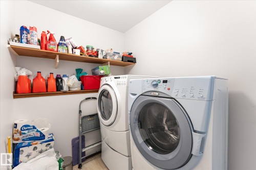 Dedicated laundry space featuring a white front-load washer and dryer set - 59 Patterson Crescent, St. Albert, AB - Indoor Photo Showing Laundry Room