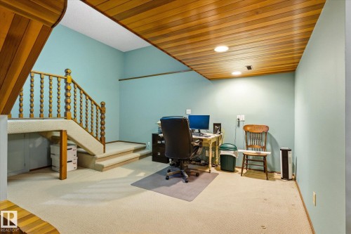 Carpeted lower level featuring a wood-panel accent ceiling with recessed lighting - 59 Patterson Crescent, St. Albert, AB - Indoor