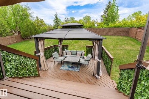 Spacious backyard featuring a multi-level wood deck, a covered gazebo, and a manicured lawn - 59 Patterson Crescent, St. Albert, AB - Outdoor With Deck Patio Veranda