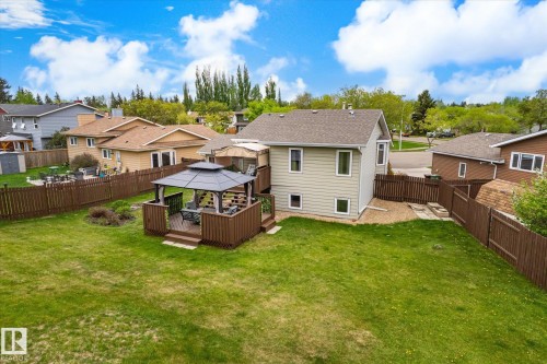 Expansive green lawn with a privacy fence - 59 Patterson Crescent, St. Albert, AB - Outdoor With Deck Patio Veranda With Backyard With Exterior