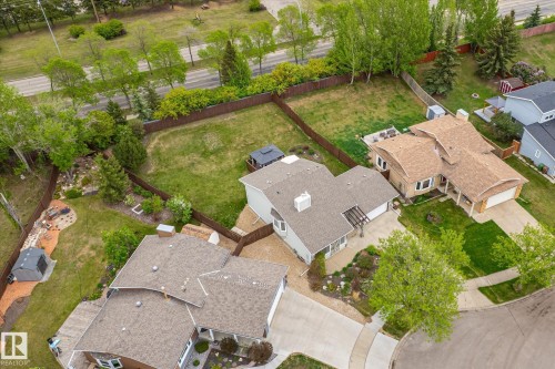 Aerial view showcasing two residential properties featuring attached garages, paved driveways, and landscaped front yards - 59 Patterson Crescent, St. Albert, AB - Outdoor