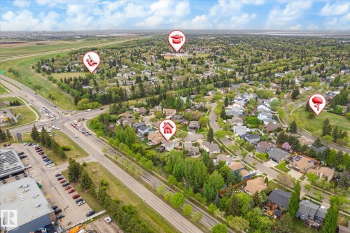 Aerial perspective showcasing a residential neighborhood with abundant mature trees and curving streets - 59 Patterson Crescent, St. Albert, AB - Outdoor With View