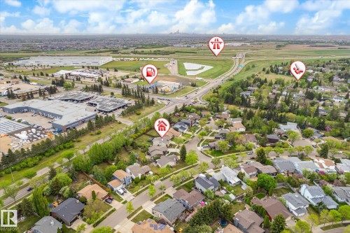 Aerial perspective showcasing a residential neighborhood with surrounding commercial developments and road infrastructure - 59 Patterson Crescent, St. Albert, AB - Outdoor With View