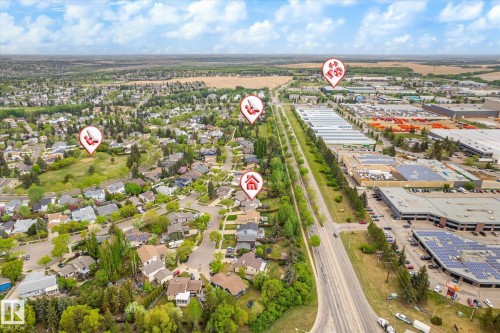 Aerial perspective showcasing a residential area with varied housing styles and mature tree cover - 59 Patterson Crescent, St. Albert, AB - Outdoor With View