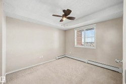 Neutral tone walls with an integrated ceiling fan and light fixture - 
