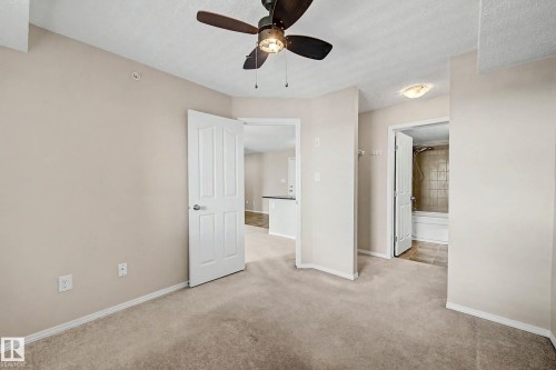 Neutral-toned carpeting throughout - 404 1080 Mcconachie Boulevard, Edmonton, AB 