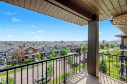 Private balcony with concrete flooring and black metal railing - 