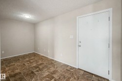 Entry area featuring patterned tile flooring, light-toned walls, and a flush-mount ceiling light - 