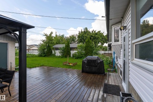 Expansive wood-finish deck offering ample outdoor living space - 13616 137 Street, Edmonton, AB 