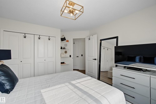 Recessed ceiling with a brass-finish geometric flush mount light fixture - 15 450 Hyndman Crescent, Edmonton, AB 