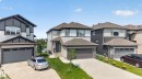 Contemporary residence featuring a two-story design, an attached two-car garage, and a concrete driveway - 2460 15 Avenue, Edmonton, AB 