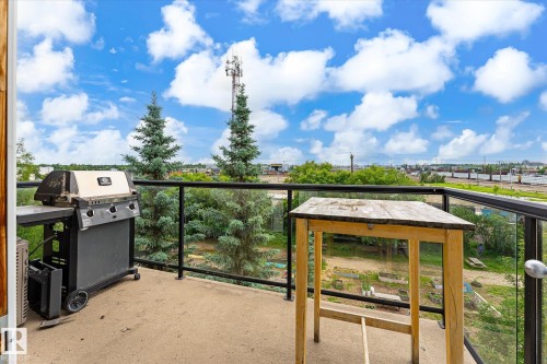 Outdoor concrete balcony with glass and metal railing - 402 10121 80 Avenue, Edmonton, AB 