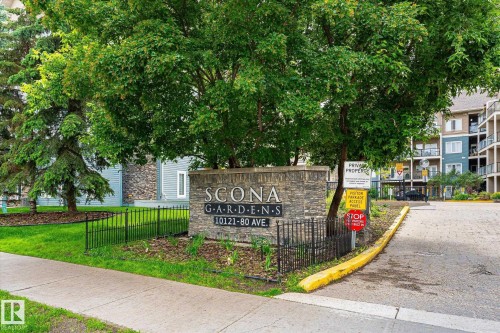 Stone-clad entrance monument featuring property signage - 402 10121 80 Avenue, Edmonton, AB 