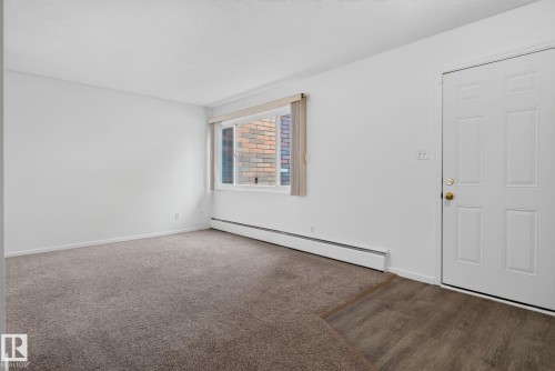 Open concept room with white walls and carpet flooring - 401 2908 116A Avenue, Edmonton, AB 