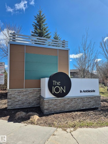 Prominent community signage featuring stacked stone accents - 112 2588 Anderson Way, Edmonton, AB 