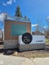 Prominent community signage featuring stacked stone accents - 112 2588 Anderson Way, Edmonton, AB 