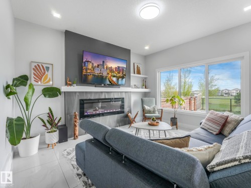 12 Sandalwood Place, Leduc, AB - Indoor Photo Showing Living Room With Fireplace