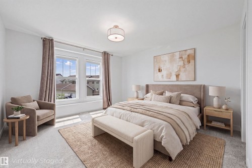 Spacious bedroom featuring plush carpeting, dual large windows, and a ceiling-mounted drum light fixture - 2953 Coughlan Green Green, Edmonton, AB 