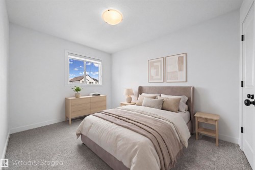 Bright room featuring neutral carpeting, a white ceiling, and a flush-mount ceiling light fixture - 2953 Coughlan Green Green, Edmonton, AB 