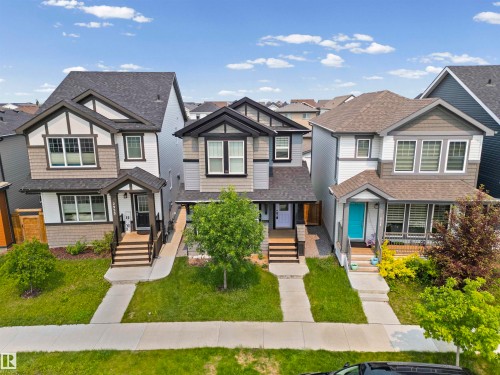 Contemporary two-story residence with a covered front entrance and front-facing multi-pane windows - 2953 Coughlan Green Green, Edmonton, AB 